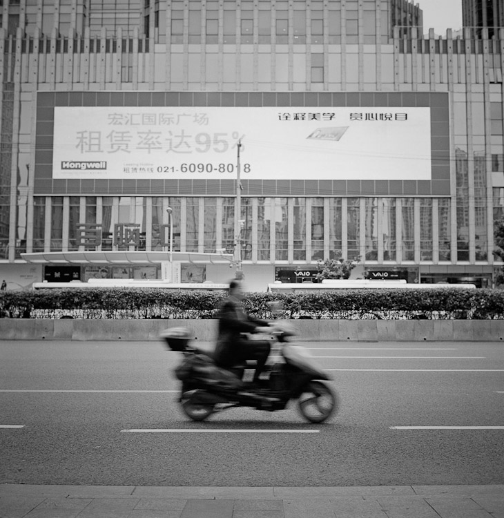 #4 Caoxi Lu, Xujiahui. I cycle down there, to where Chambers waits.