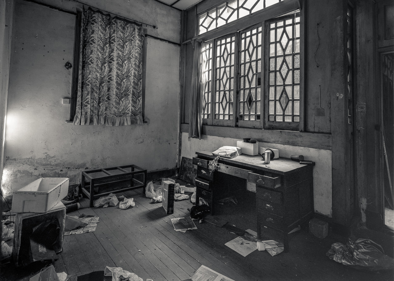 #8 Some buildings are surprisingly intact - although completely locked up and inaccessible. This one had an open window where the camera just fit through.
