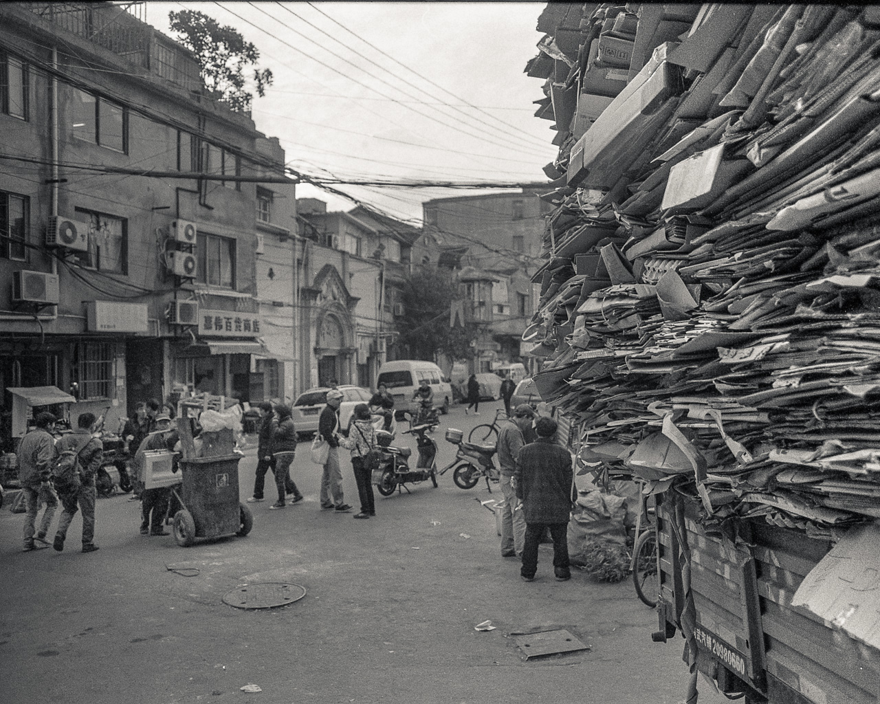 #14 A roadside stack of cardboard.