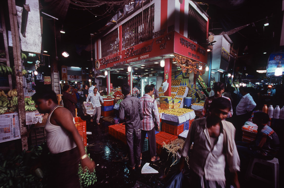 #20 intersection in Crawford Market, one side is fruits, the other side sells animals