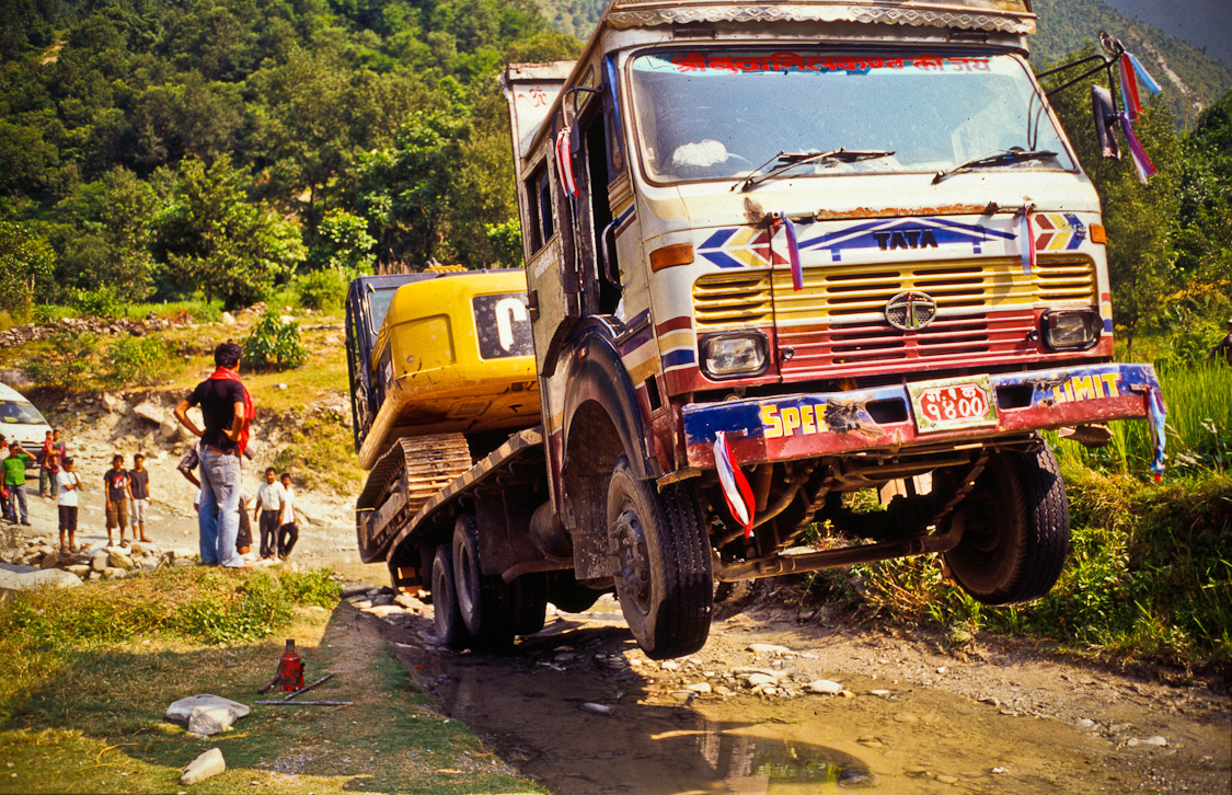 #17 on the road to Beni. Truck got stuck. Caterpiller dug its own ramp and drove off. Skillz.
