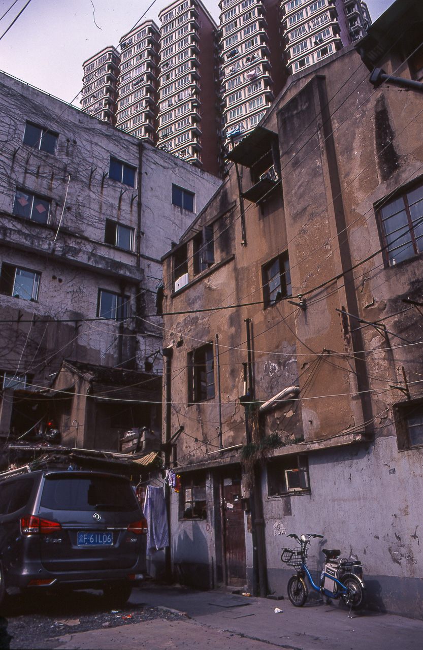 #40 Good old juxtaposition of old and new. Old buildings disappearing, new ones propping up. I have been told that real estate prices have exploded in the past few years since we left.