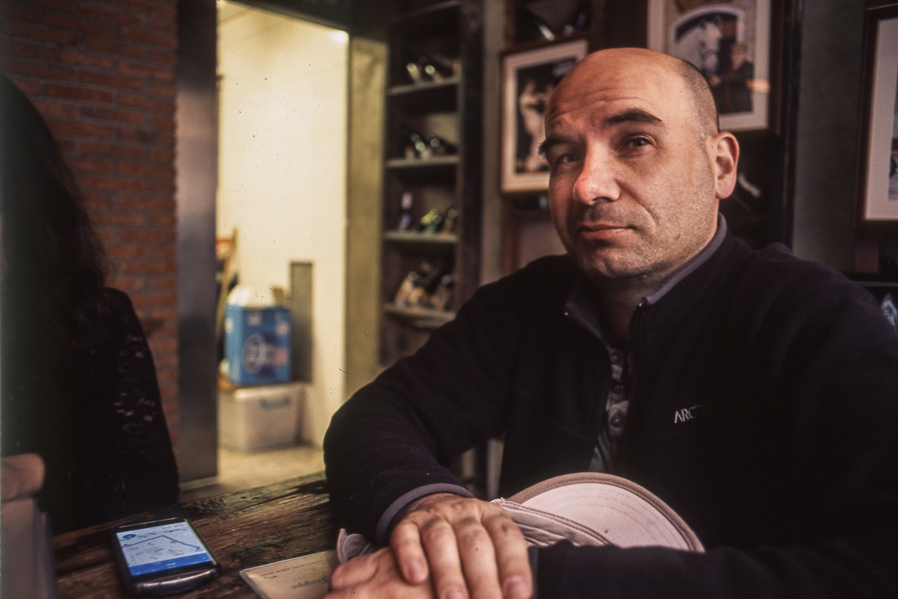 #42 Bryan being all smug about his cap and the Vedett beer he ordered.