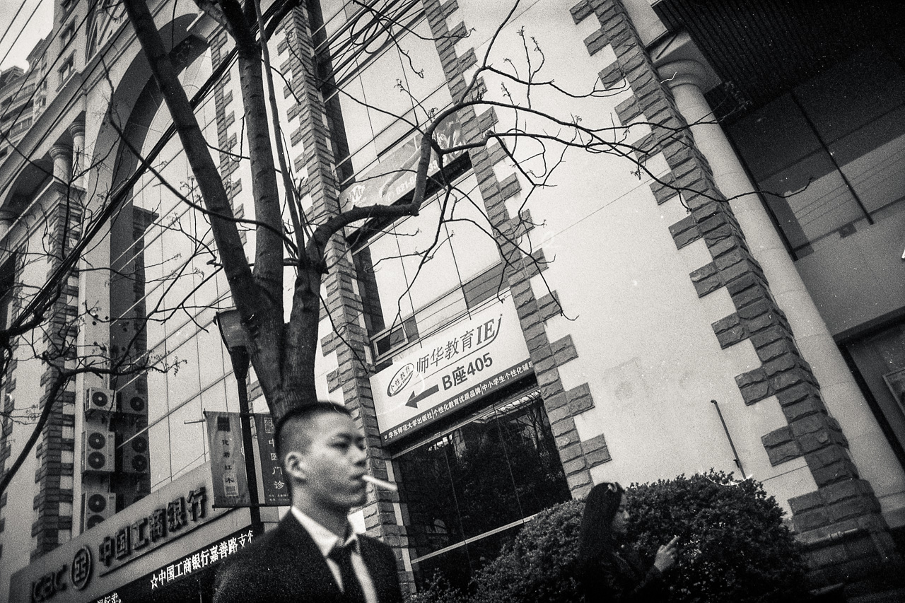 #19 walking down to Yongkang Lu I tried to take a snapshot of this snazzy gentleman and his cigarette but forgot to focus. I still like it.