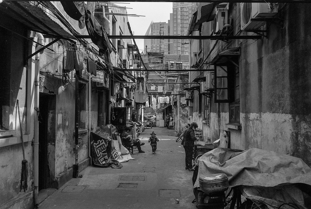 #65 Some alleys still have life in them. I wonder what that kid will remember of the place growing up.