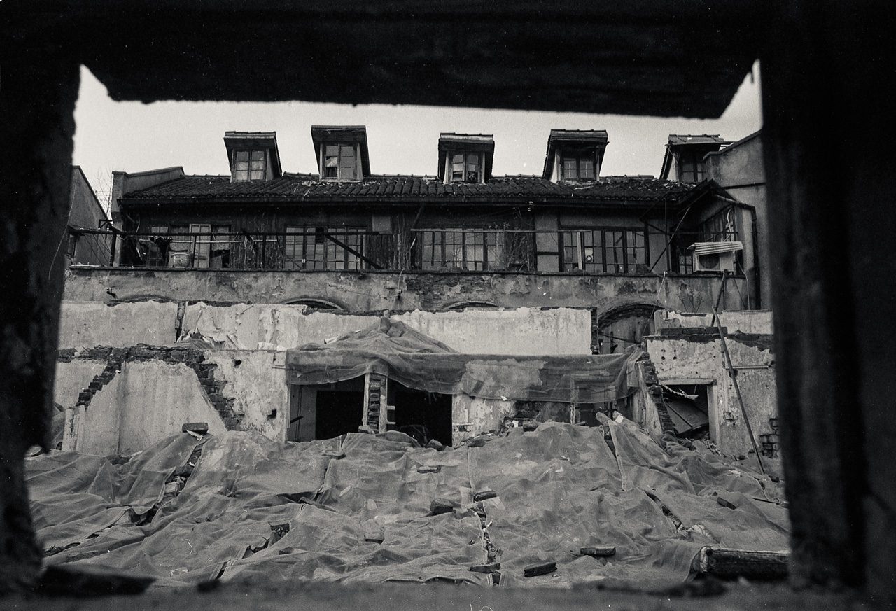 #55 Entire backyards facing empty shells of buildings.